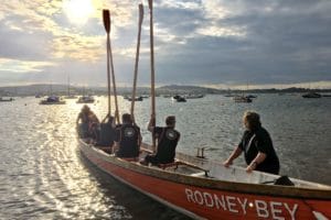 a rowing boat and crew