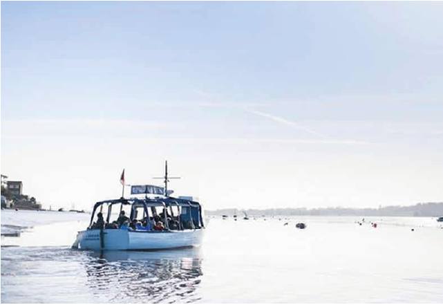 RSPB boat out on the water with passengers