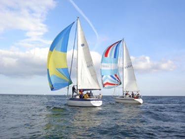 Two sailing boats on the open sea